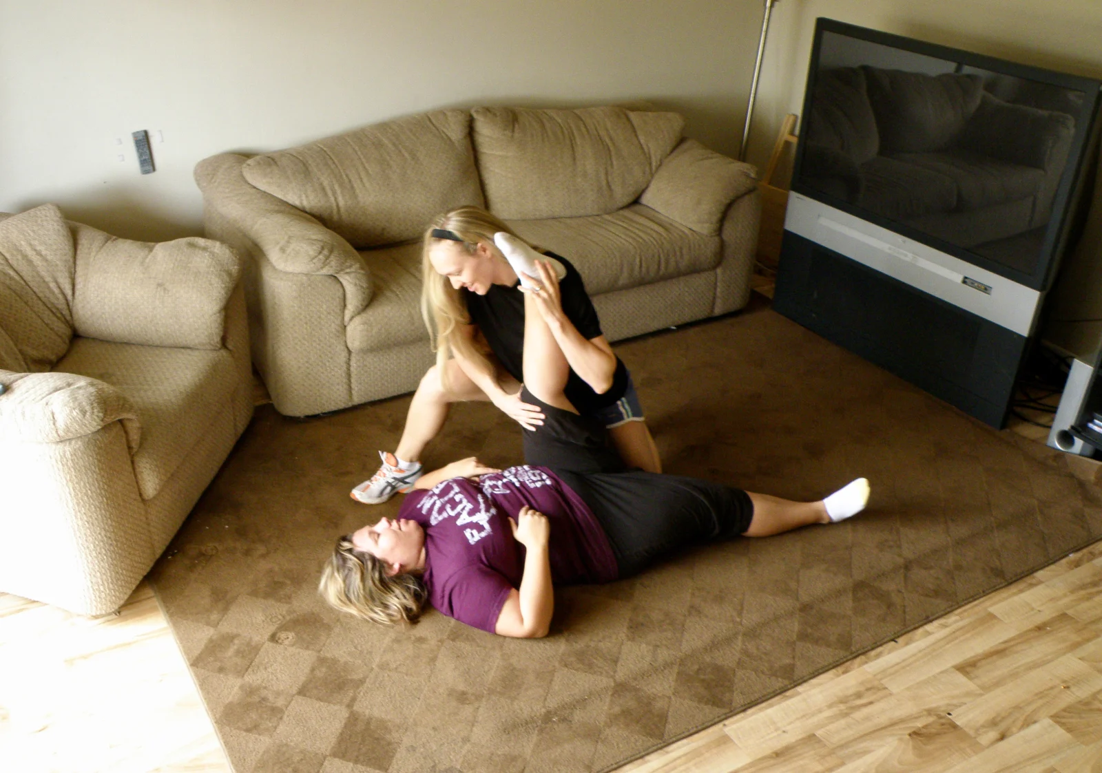 cc-home-about-stretch Cathleen coaching an assisted stretch at home