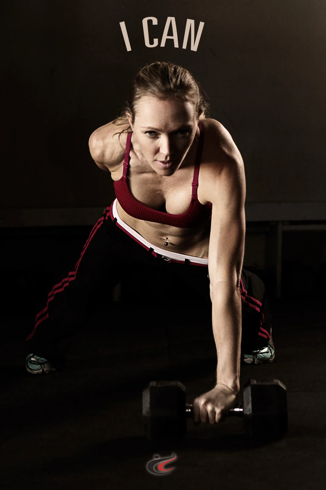 CC Training client holding a plank on a dumbbell during an online coaching program